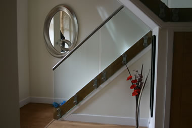 Frameless glass with stainless steel handrail
